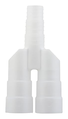 Raccord blanc en Y pour tubes de condensats posé près d’une goulotte de climatisation.